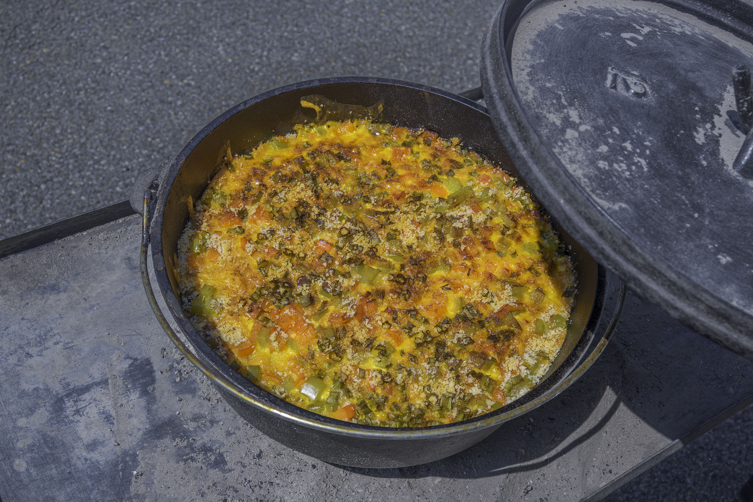 Easy Dump and Bake Spanish Rice and Chicken Casserole Baked in a Camp Cast Iron Dutch Oven